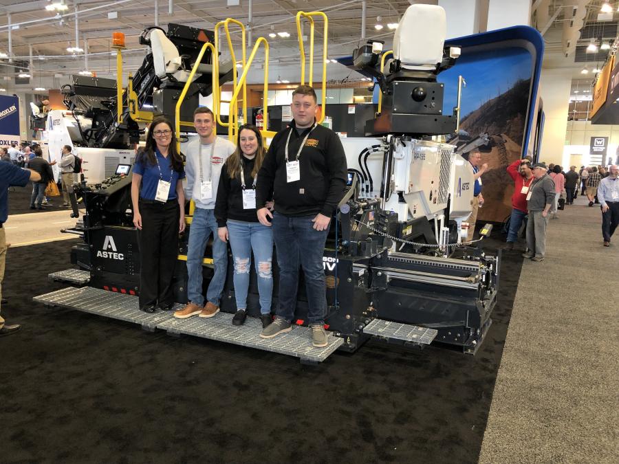 (L-R): Sue Luse of Astec and Nick Cuneo, Angela Pappas and Robert Przestrzelski, all of Cuneo Paving in Wharton, N.J., stand on the Astec RP195 paver, a powerful, rubber-track paver made for highway work. 