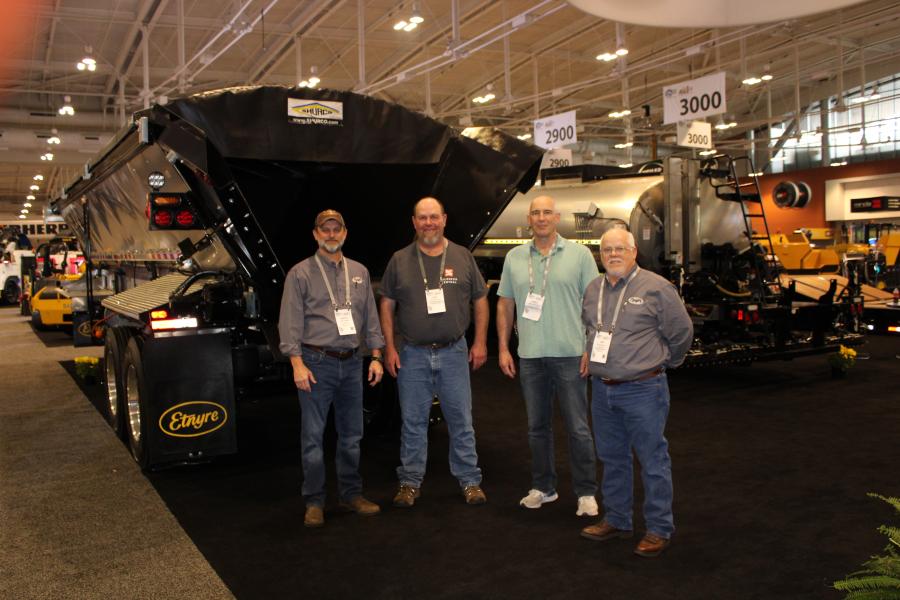 At the Etnyre booth (L-R) are Jason Sasser of Etnyre, Dan McLean of Tri County Paving, James Brierley of Pape Machinery and Tim Hoover of Etnyre.