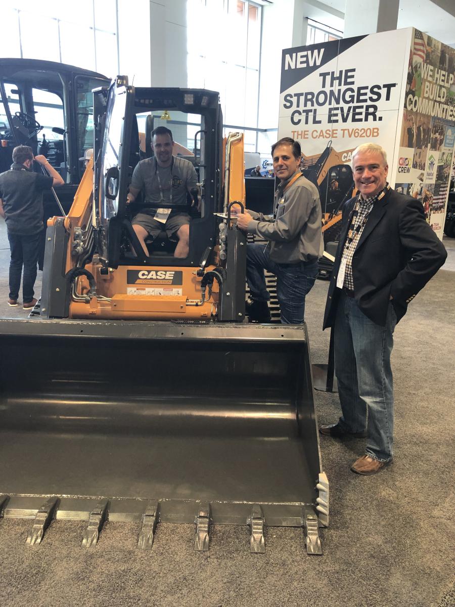 Case had several machines on display. Getting the feel for the strongest Case CTL ever, the TV620B, (L-R) are Luke Dowsland of the town of Hamilton, N.Y., while Jeff Tacobsmeyer and Skip Owen, both of Case, explain the features and benefits of the machine.
