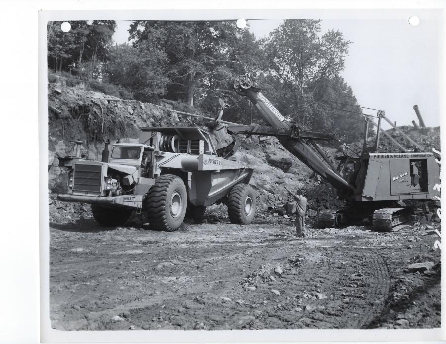 Heavy grading for Poirier & McLane with a Manitowoc 3600 shovel loading a LeTourneau-Westinghouse B 35-ton capacity rear dump. Rock wagons like this offered the same or superior capacity compared to convention end dumps with much better maneuverability. 
(Manitowoc Company photo/HCEA)
