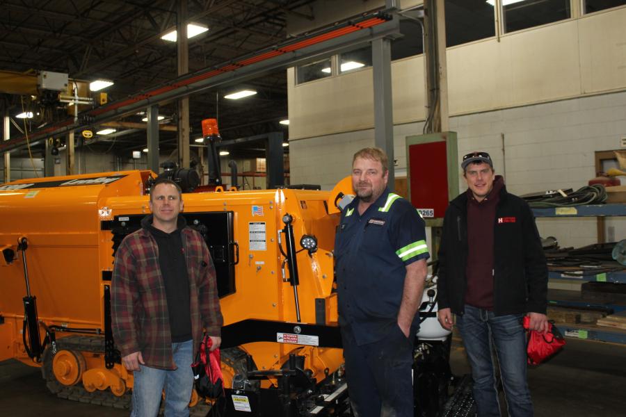 (L-R): Mark Hanson, owner of Hanson Paving, St. Cloud, Minn.; Jeff Grant, service technician of RMS; and Noah Hanson, engineering operator of Hanson Paving, check out the LeeBoy 5300 asphalt paver.