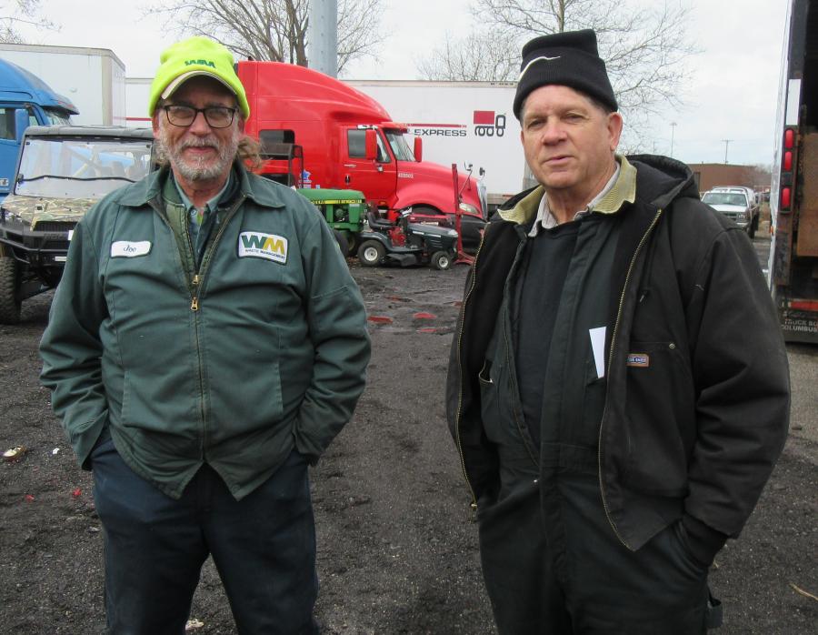 Joe Isom (L) of Waste Management and his brother, Wayne, of Patten-Turner, came to see the skid steers.