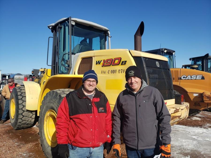 Looking over this New Holland W190B wheel loader were Brad Carey (L) and Jim Barry of Swiderski Equipment Inc.