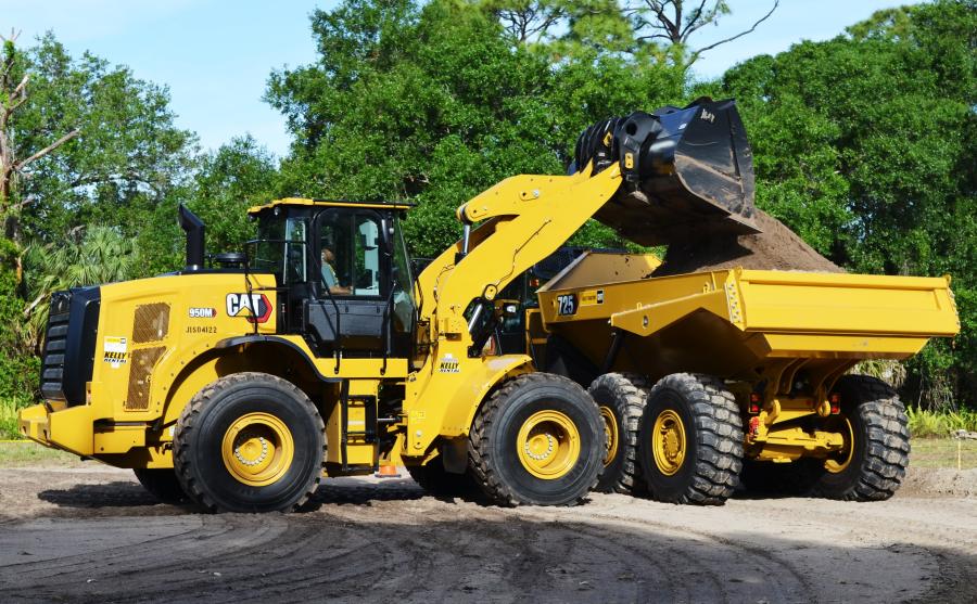 On the Load and Go challenge, Leonel Lopez of Quality Enterprises USA, Naples, Fla., uses a Cat 950M wheel loader to load up a Cat 725 articulated truck.
