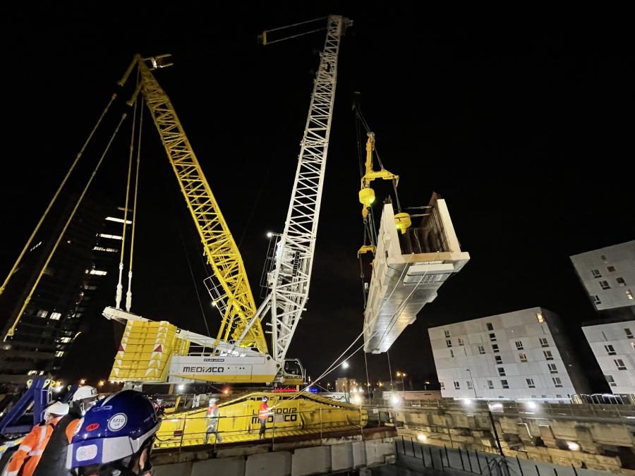 Over the next two years, a total of 100 beams weighing up to 215 ton and measuring up to 85 ft. long, 8.2 ft. wide and 11.5 ft. deep will be positioned by Enerpac SyncHoist lifting cylinders suspended beneath a spreader beam lifted by a LTM 1600 crane provided by the Mediaco Levage Group.