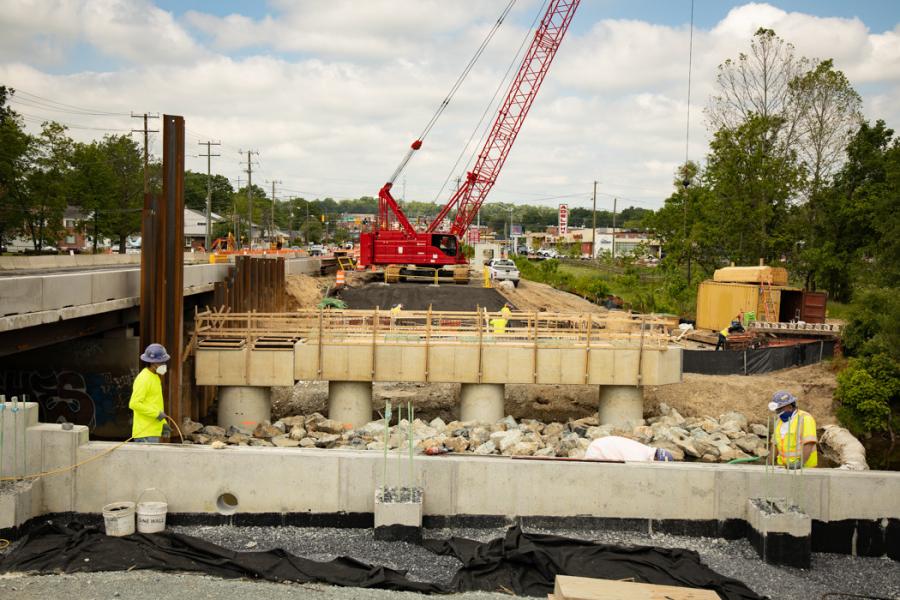 The Purple Line is designed to provide faster, more reliable east-west transit service than buses in older, auto-dependent suburbs and connect communities with Metro, Amtrak and the MARC commuter rail system. Here, construction of the Northwest Branch Bridge abutments continues.
