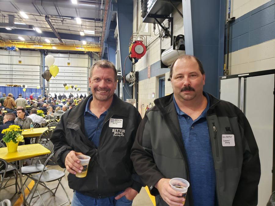 Luke Dernovsek (L) and Ken Baker of Kraemer Mining came to Fabick Cat’s Season Opener to see what new products are available. 
