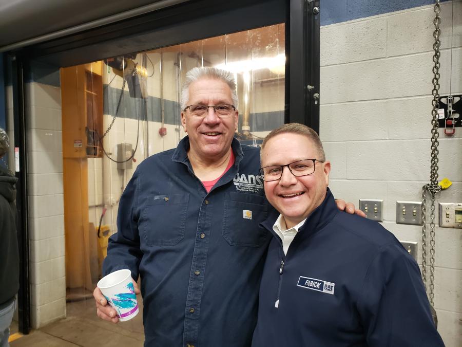 Dan Olson (L) of Dan’s Construction and Excavating of Chippewa Falls, Wis., and Mark Hanson, senior vice president of Fabick Cat, catch up during the Season Opener.

