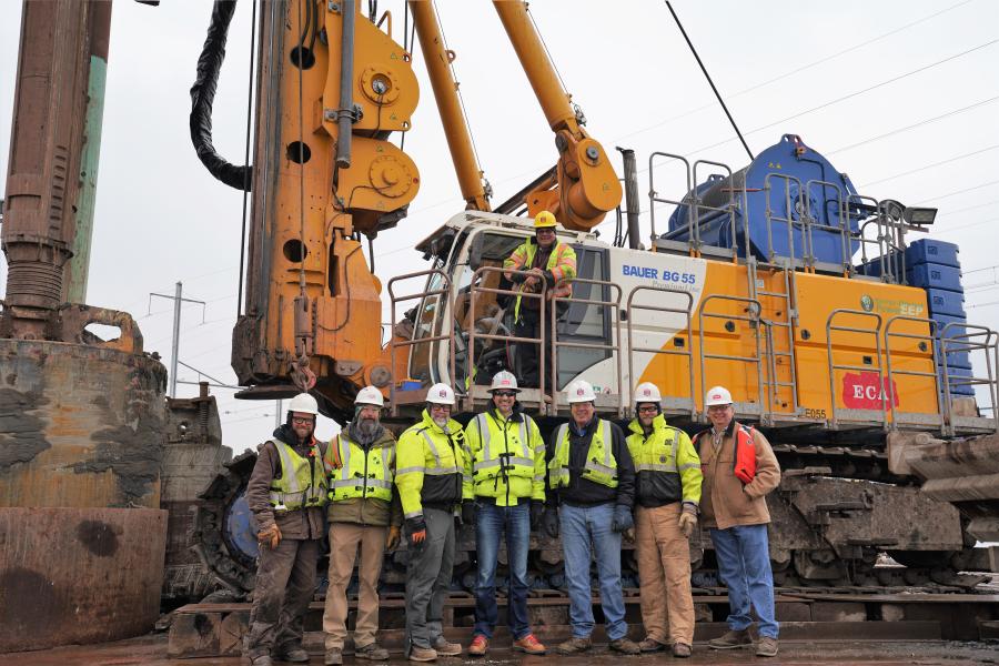 Members of the ECA and Harms teams are pictured with the barge-mounted BG 55 on the Raritan River Bridge project. (Brian Fraley photo)