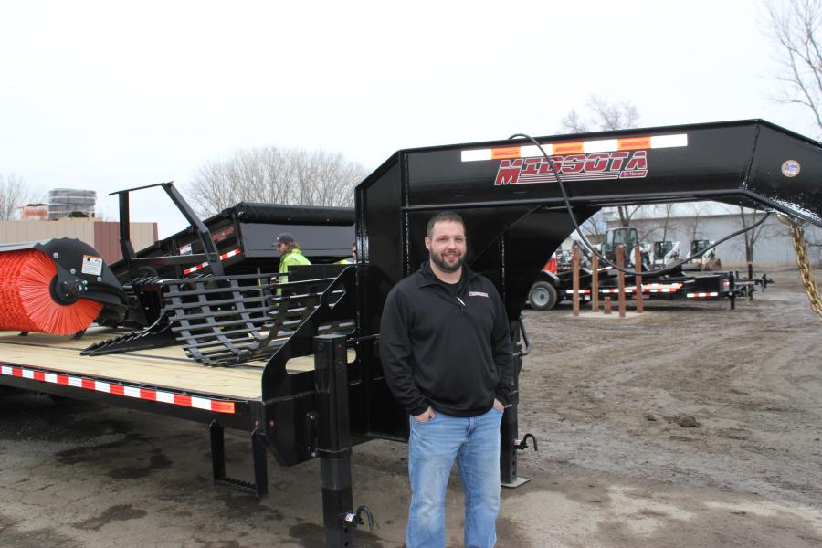 At the St. Cloud open house, Nick Rademacher, new sales account manager of Midsota Trailers in Avon, Minn., shared the benefits of the 32-ft. gooseneck NFP32GN.
(CEG photo)