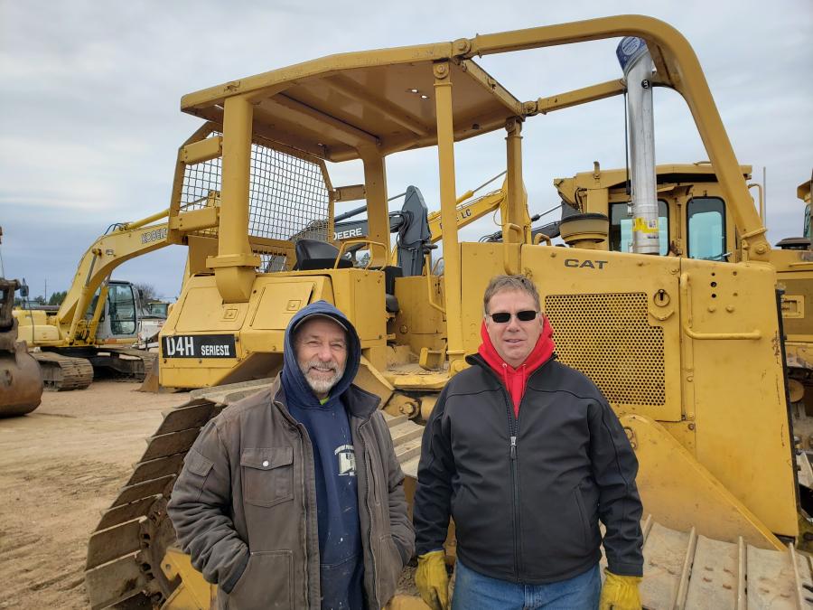 John Rottier (L) of J Rottier Construction and Mike Dresel of Mike Dresel Excavating and Landscaping of Jim Falls, Wis., consider bidding on this Cat D4H dozer.
(CEG photo)