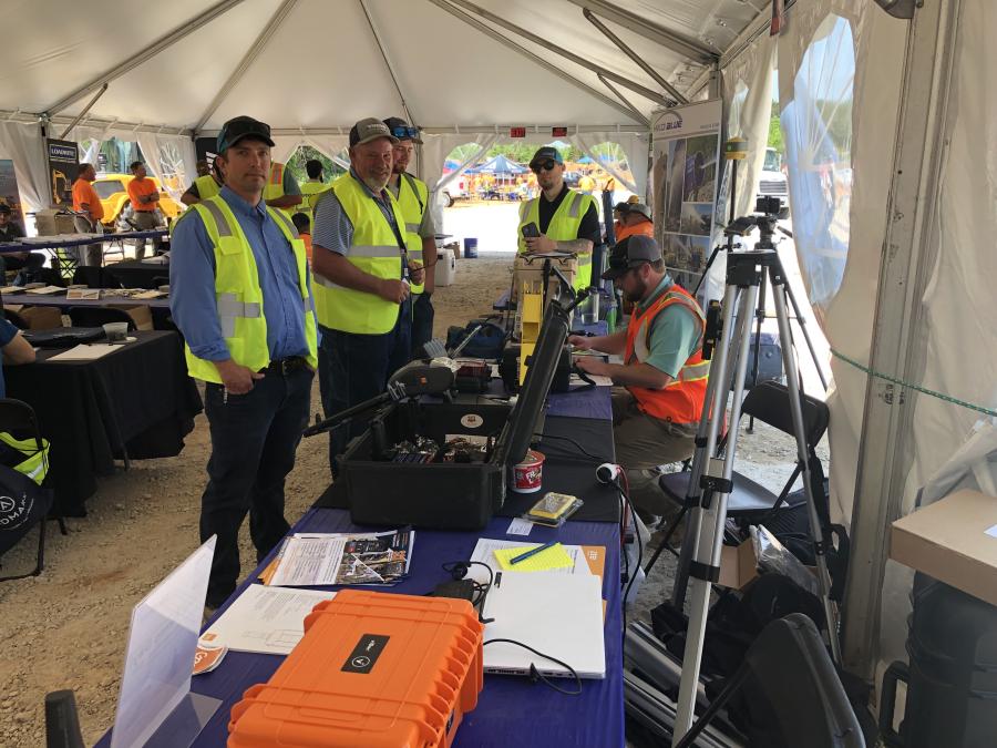 Benchmark Tool & Supply had several of its Topcon Machine guidance systems on hand for contractors to look over and learn about.  (L-R) are Mike Gaillard, Benchmark; Charles and Joe Norris, Norris Diggin in Todd, N.C.; and Sean Bronson and Adam Leviner of Benchmark.
(CEG photo)