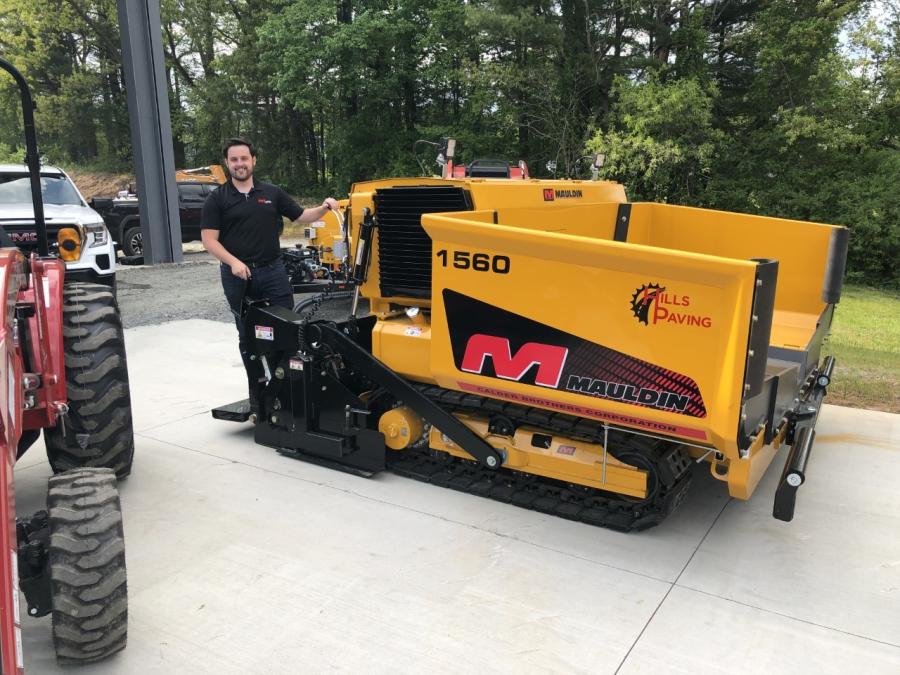Zach Lincolnhol of Mauldin Paving Products stands with the popular Mauldin 1560 paver. It has a Freedom 14 screed with automatic match height.
(CEG photo)