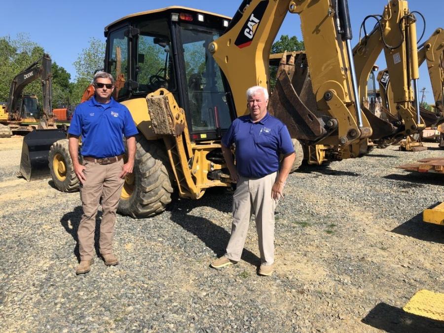 Garrett Jones (L) and Doc McGee, both of McGee Brothers in Monroe, N.C., looked over the Cat backhoes and found one that suited their needs.
(CEG photo)