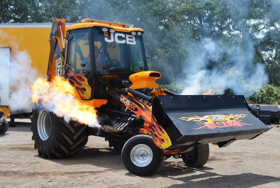 Firing up the 1,500 hp JCB GT, the fastest backhoe on earth, and putting on quite a show of some fast-paced machine action is JCB’s demo operator/coordinator Ferrin Barber.  
(CEG photo)