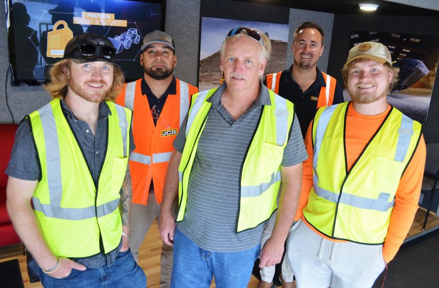 A group from Schram Services, Hudson, Fla., including (L-R, front row) Austin, Robert and Colton Schram, join their Briggs JCB reps (L-R, back row) Joey Guzman and Billy Burr to enjoy the days festivities.   
(CEG photo)
