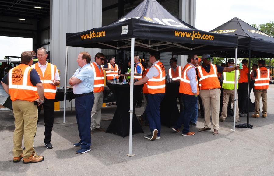 A steady stream of customers joined their Briggs JCB friends and JCB corporate representatives at the open house. 

(CEG photo)