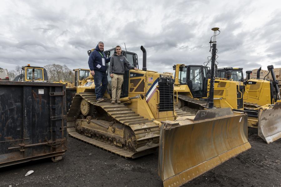 Jamie Carpenter (L) and son, Jay, of JF Carpenter in Plymouth, Mass., check out a 2011 Caterpillar D6N LGP dozer.
(CEG photo)