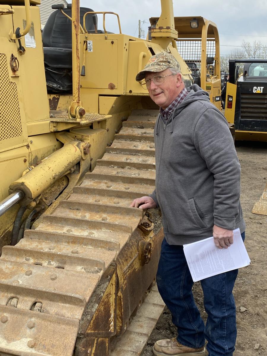 Tom Lewandowski of T & L Sand and Gravel in Greenwich, N.Y., checks out a Cat D5 to see if it would be a good addition to his pit.
(CEG photo)