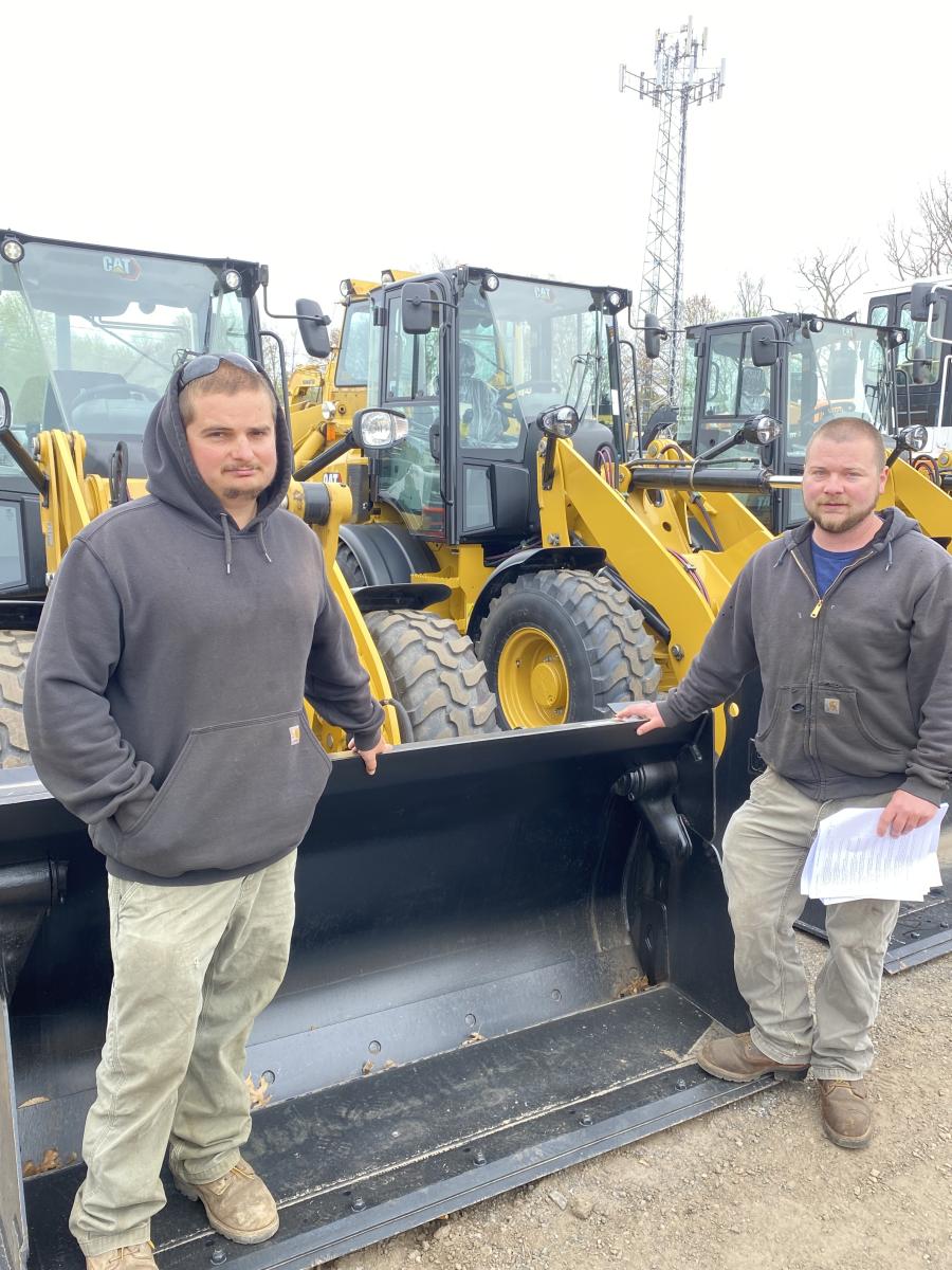 Justin (L) and Tom Zimmitti of Zimmitti Excavation in Portland, Conn., had their eyes on a Cat 906M loader.
(CEG photo)