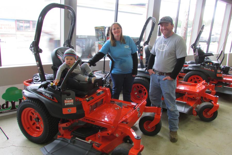 Joe (R) and Jessica Kealler and their son, Noah, all enjoyed stopping by for lunch and to check out (or play on) Kubota equipment.
(CEG photo)