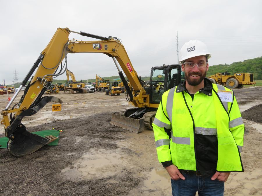 Travis Gillespie of Gillespie Excavating in Springfield, Mo., waits his turn to run the Cat 308 excavator.
(CEG photo)