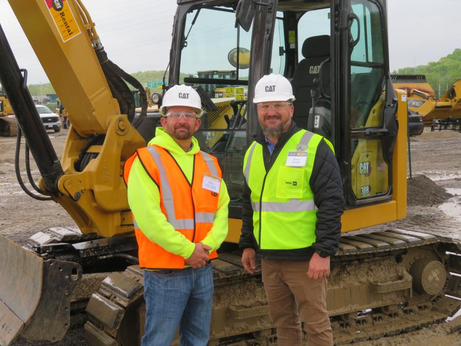 Mike Wallace (L) of Diestelkamp in the South County-St. Louis metro area and Shane Boyer of Fabick Cat discuss the different operating stations at the Caterpillar Operator Challenge.
(CEG photo)