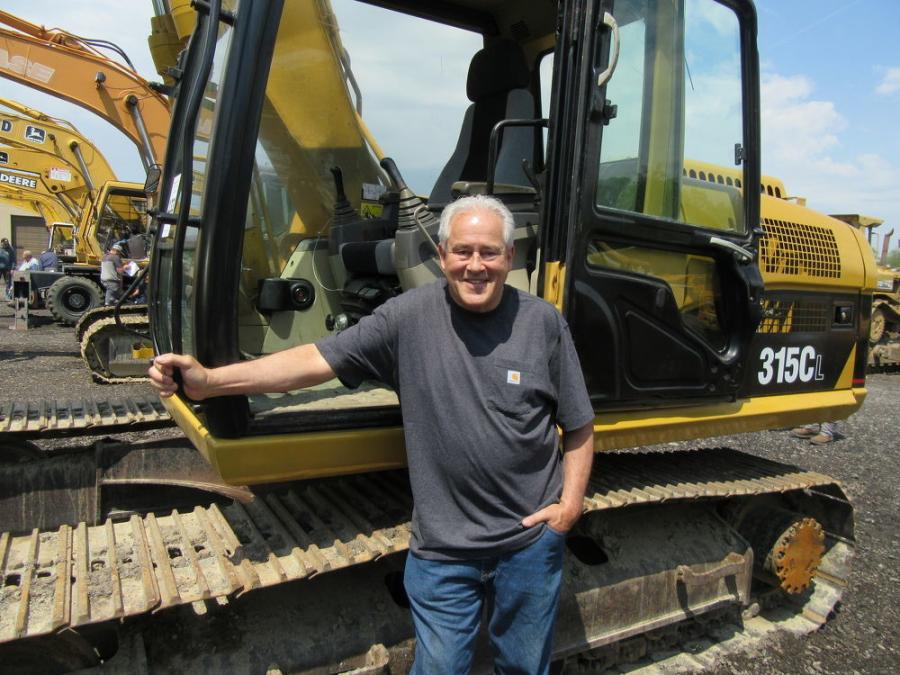 Doug Merrill of K&G Automotive looked over the excavators for use to wreck cars for scrap at his equipment yard.
(CEG photo)