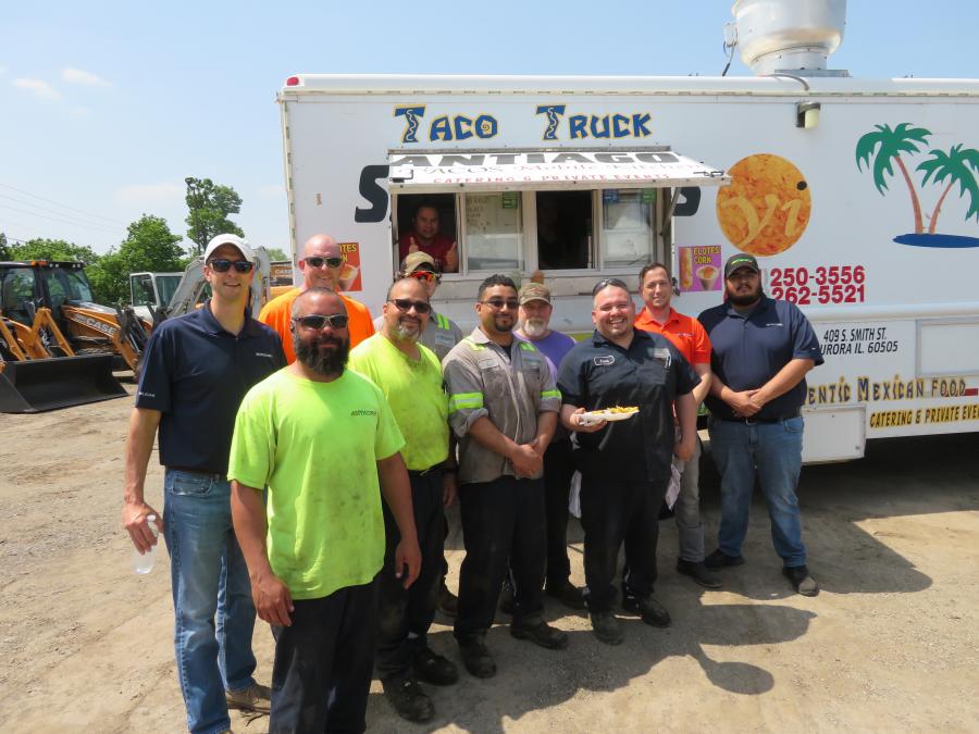 Jim McCann (back row L), CEO of McCann Industries, and all the technicians from the Bolingbrook facility enjoy some tacos at the used equipment open house.
(CEG photo)