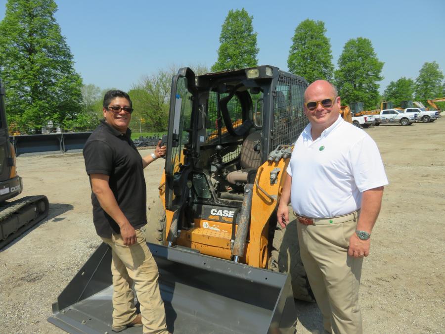Jorge Rodriguez (L) and Tom Lawler, both of William Hach & Associates Inc., look over this Case skid steer.
(CEG photo)