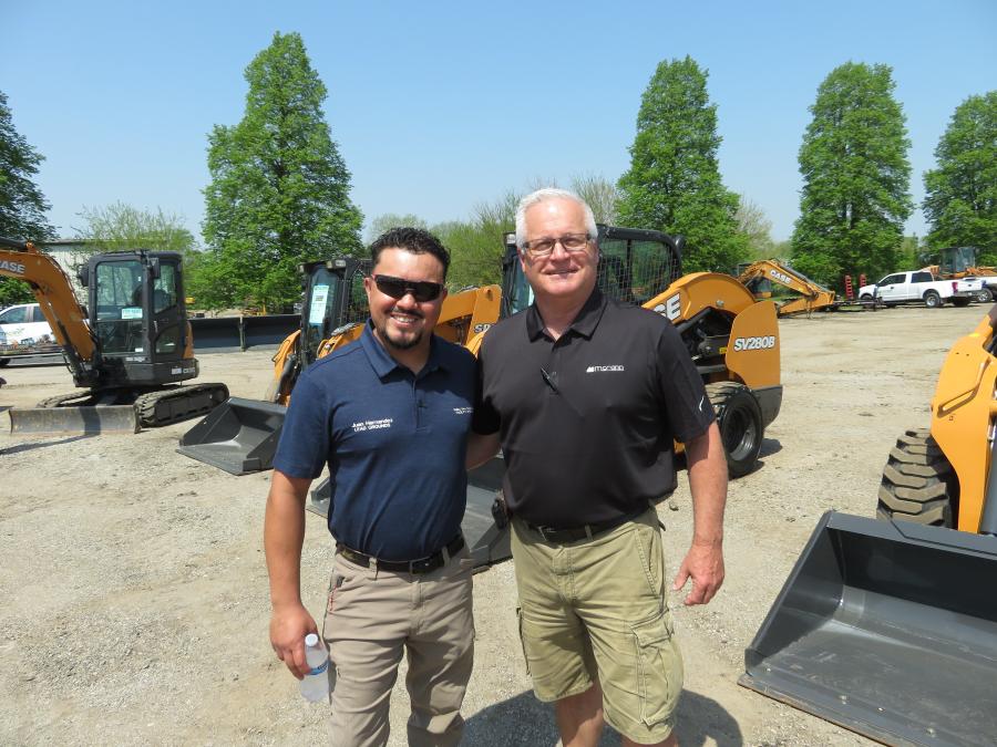Juan Hernandez (L) of Valley View School District and Steve Costello, McCann Industries sales representative, go over the details on this Case SV280B skid steer.
(CEG photo)