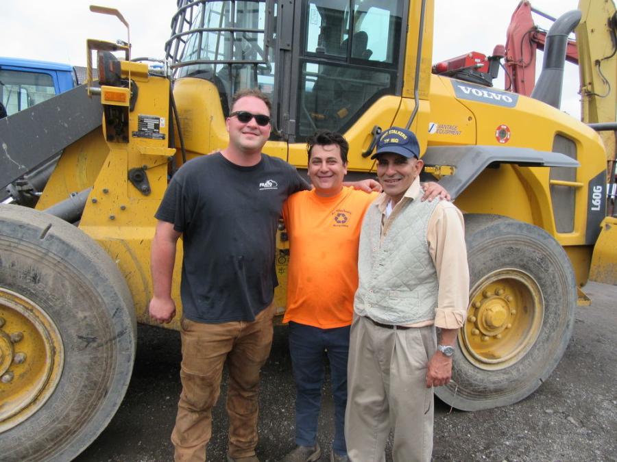 (L-R): Cousins Joe Frato and Joe Frato of Frato Products join Bob Tripodi to review the wheel loaders that were up for auction.
(CEG photo)