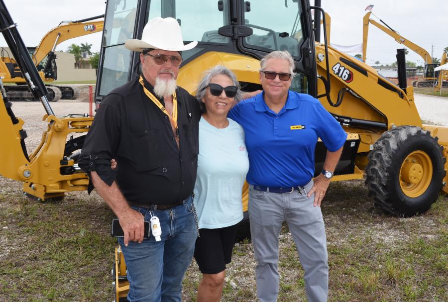 Customers and friends gathered at the event (L-R) including William Warner and his wife, Marcele, of Downrite Engineering, Miami, Fla., and their Kelly Tractor representative, John Lynch. 
(CEG photo)