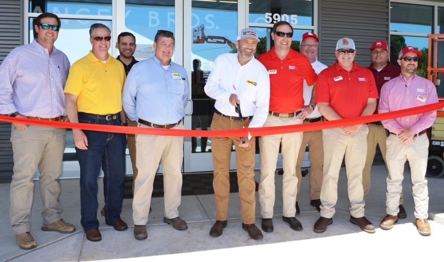 Yancey Bros. Co.’s president/COO Trey Googe (C) was joined by the staff members that helped to make this facility a reality as he cut the ceremonial ribbon.
(CEG photo)