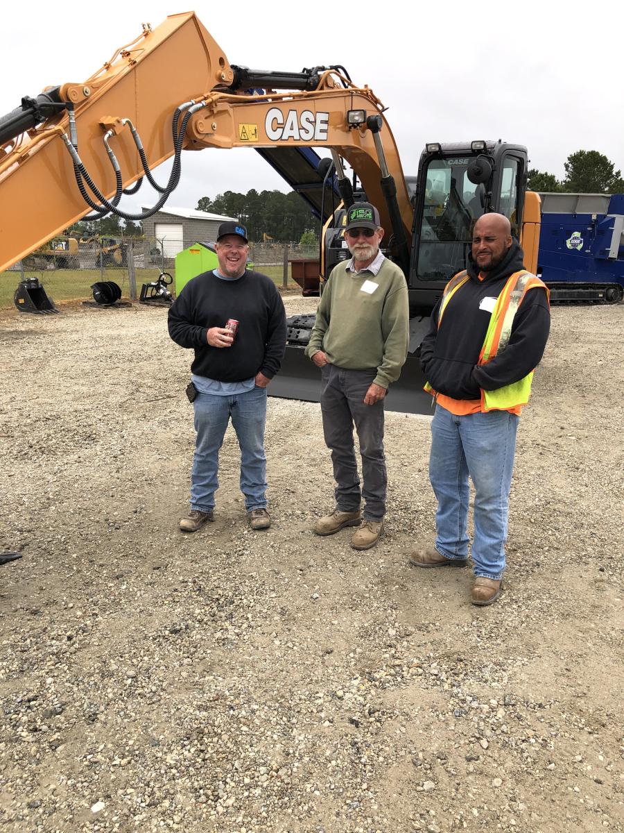 (L-R): Shaun Hodge, John Lineweber and Carlos Monge, all of Hodge Excavating & Grading in Rocky Point, N.C., check out the Case CX145D excavator.
(CEG photo)