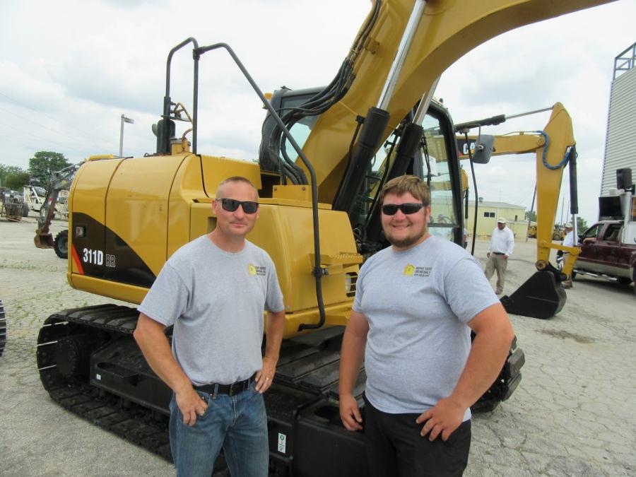 Rodney (L) and Aiden Kiefer of Rodney Kiefer Construction LLC were pleased to have placed the winning bid on this Caterpillar 311D excavator.
(CEG photo)