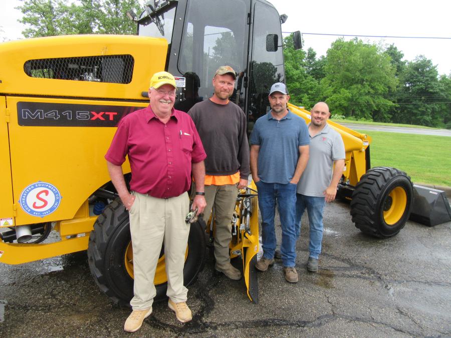 (L-R): Buster Prince of the city of Newark joined Licking County’s Jordan Susil, Trent Sforza and Loren Dobbins to look over this Mauldin M415XT, which comes equipped with a motor grader blade, loader bucket and a scarifier on the back.
(CEG photo)
