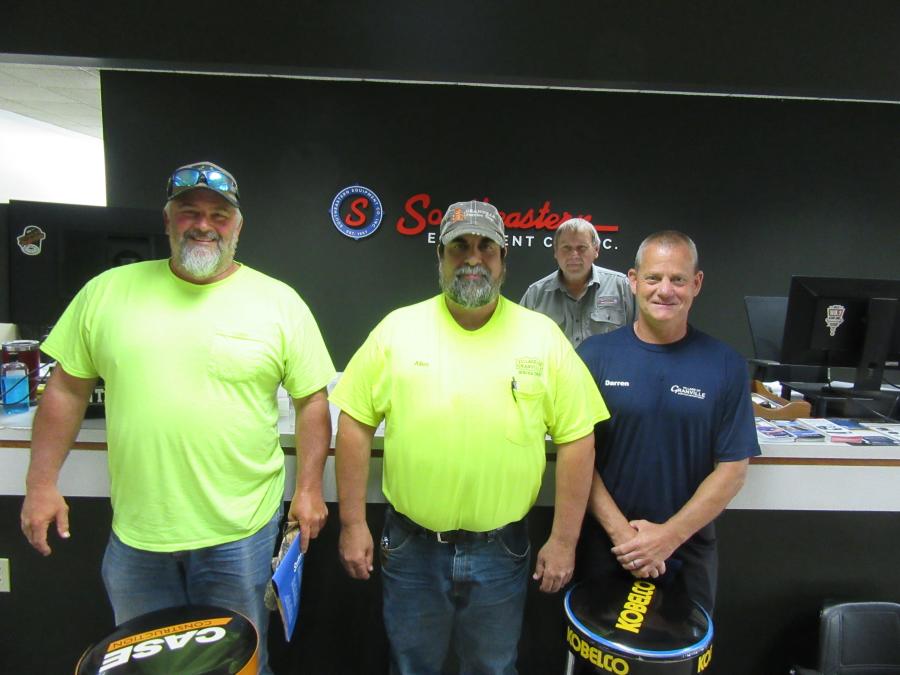 (L-R): Ron Brown of the city of Heath along with Allen Stevens and Darren Willey, both of the village of Granville, check in with Southeastern Equipment’s Gary Buck at the parts counter.
(CEG photo) 