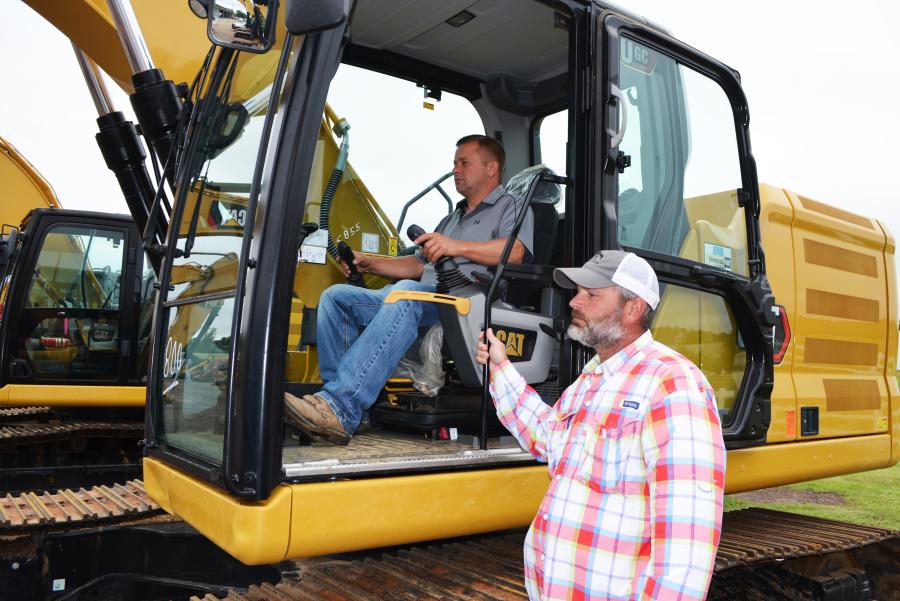 Test operating an incredibly nice late model Cat 320GC excavator are Brad Parker (in cab) of Parker’s Dozer Service, Forest, Miss., and Danny Haralson of DUBCO Construction, Conehatta, Miss.
(CEG photo)