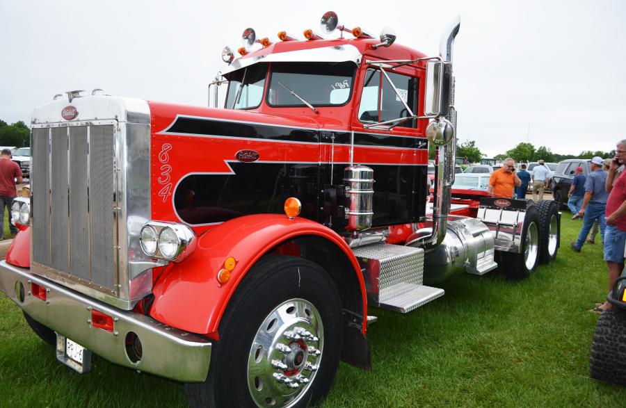 At the center of the antique and classic cars and trucks, this beautifully restored, show room condition 1969 Peterbilt truck-tractor garnered a whole lot of attention from auction attendees.  
(CEG photo)