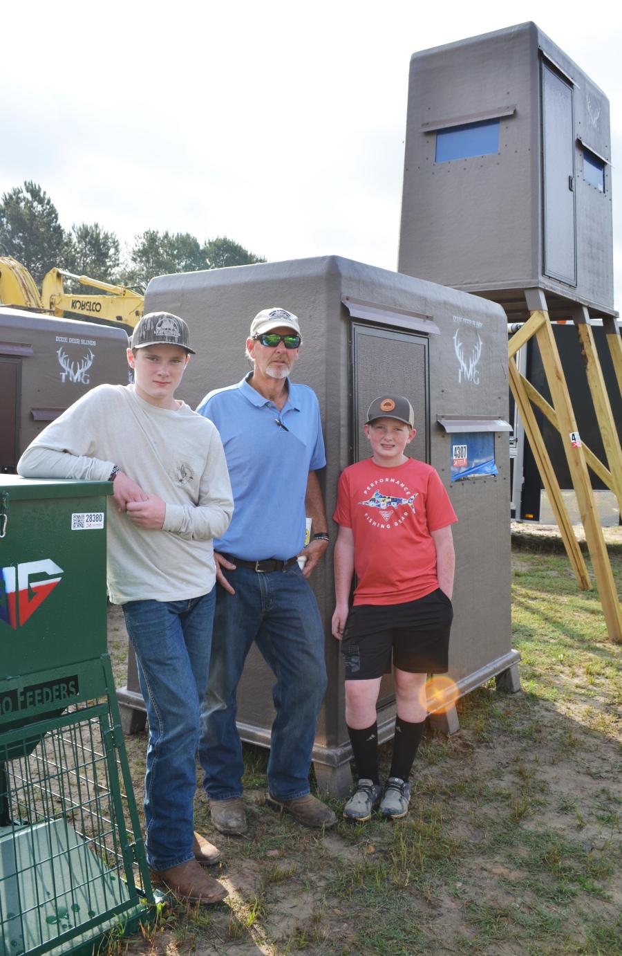 A regular seller in the Joey Martin sales, Heath Dorman (C) and his sons, George (L) and Landon of Leavellwood Inc., were auctioning a large selection of fiberglass shooting houses and deer feeders. The Eutaw, Ala.-based company is the largest manufacturer/distributor of shooting houses east of the Mississippi River.  
(CEG photo)