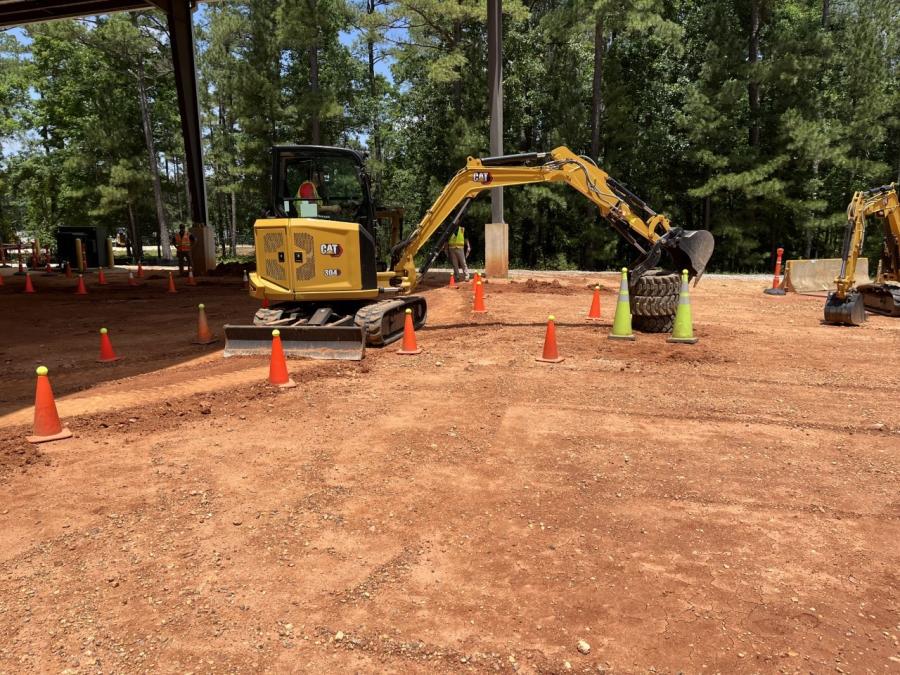 In the “Mini Master” segment of the operator challenge, the contestant navigates the course and moves tires using a grapple mounted on a Cat 304 excavator.
(CEG photo)