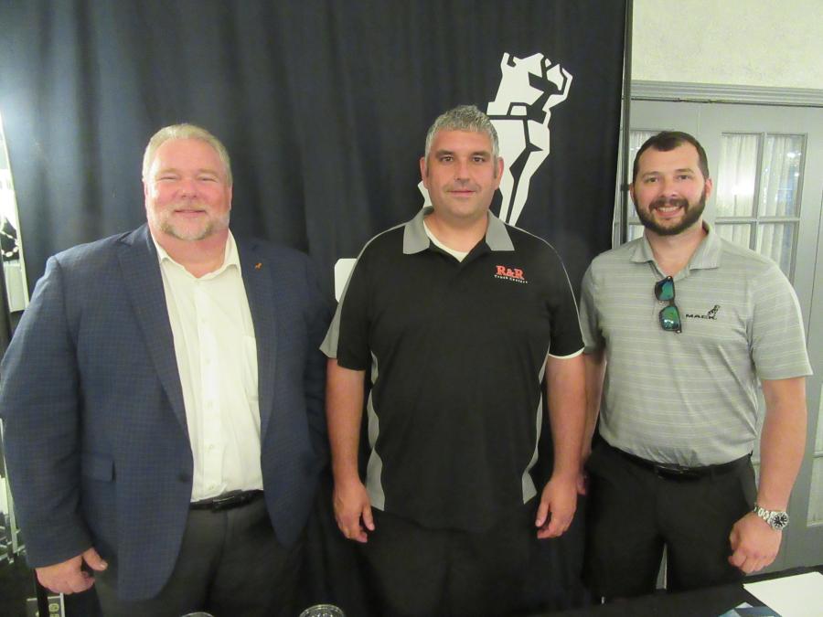 (L-R): Eric Toth, Mack Truck district manager, joined R&R Truck Sales’ Chris Savich and David Wervey Jr. to discuss Mack Truck’s new 100 percent electric truck. 
(CEG photo)