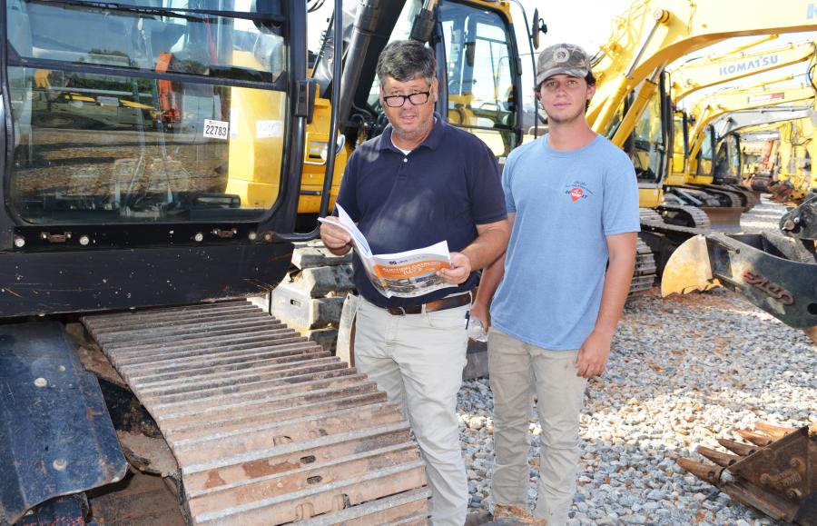 Looking over several excavators of interest are Harris Echols (L) and Thomas Echols of Underground Excavating, Patterson, Ga.  
(CEG photo)