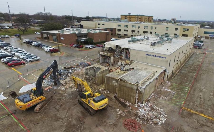 he operation required several pieces of equipment, including a 75-ft.  John Deere  350 high reach, a Komatsu 390 tracked excavator, a John Deere 755 front end loader, a Cat 963 front end loader, a John Deere 350 regular stick.
(JR Demolition photo)