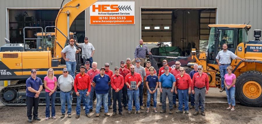 Hyundai has expanded its network of dealers with the addition of HES — Holland Equipment Services, in Holland, Mich. Aric Geurink, president of HES (far R, standing on wheel loader step), calls the arrangement “a win for both our dealership and our customers.”