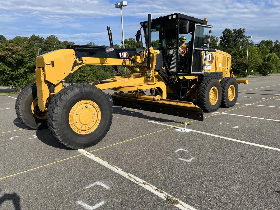 Attendees had the opportunity to drive this Cat 140 motor grader from Carter Machinery through the obstacle course. The contestants had to knock the tennis ball off the stand with the mold board while leaving the stand untouched. (CEG photo)