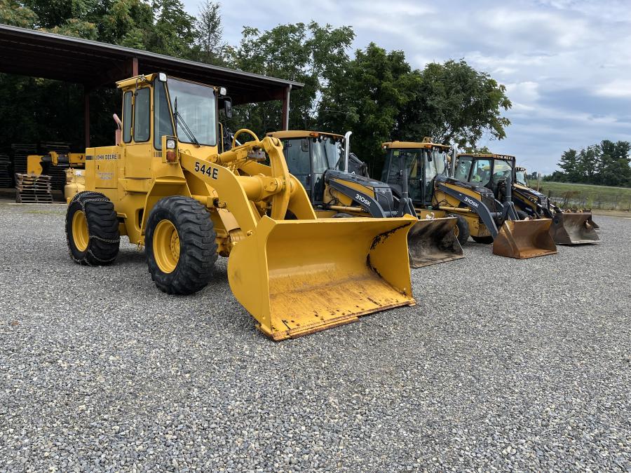 The auction included these well-maintained John Deere and Cat backhoes and wheel loaders. (CEG photo)