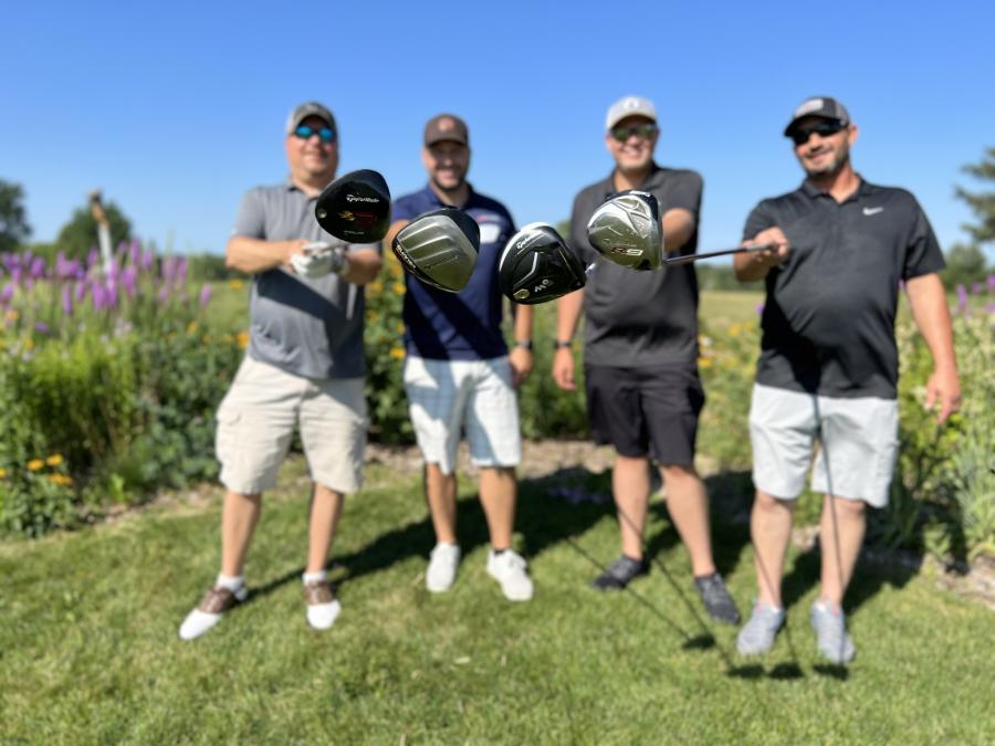 (L-R): Ben Anderson, Trent Lundquist, Brody Olson and Travis Swanson, all of Shaw-Lundquist Associates Inc., show off their clubs.
(AGC of Minnesota photo)