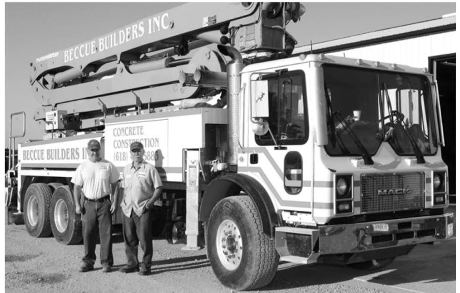 Steve (L) and Don Beccue proudly stand beside their new Putzmeister pump truck — making concrete work a lot easier.